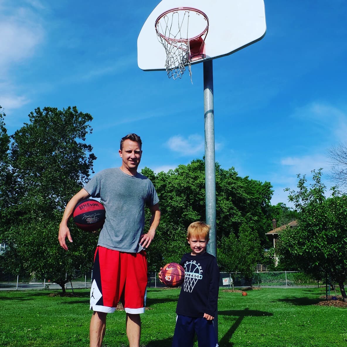 Luke with his son on the court